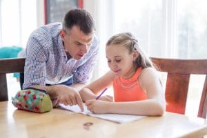 Tutor working with student in home for math tutoring